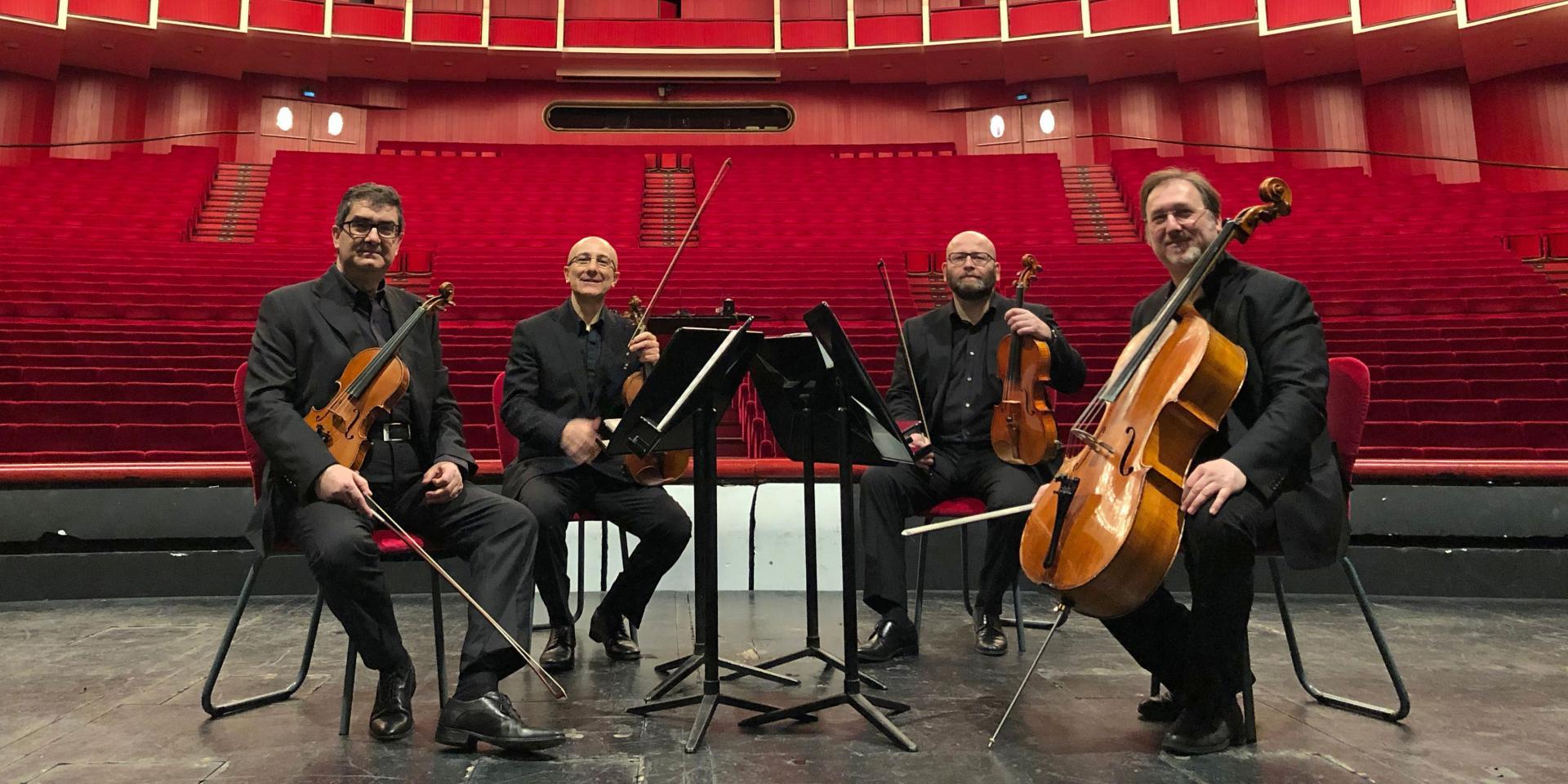 Il Quartetto in posa sul palcoscenico del Teatro Regio