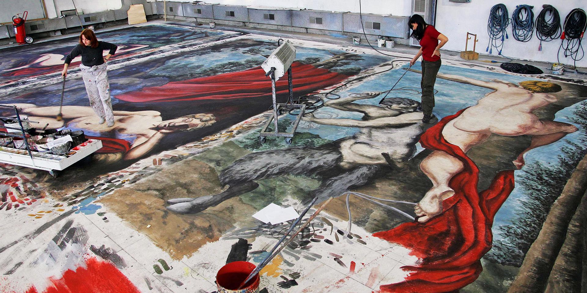 Backdrop painting at the sets workshop (ph Ramella&Giannese © Teatro Regio Torino) Backdrop painting at the sets workshop