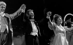 From left: Enzo Dara (Don Pasquale), Bruno Campanella (conductor), and Luciana Serra (Norina) receive applause on the stage of the Teatro Regio