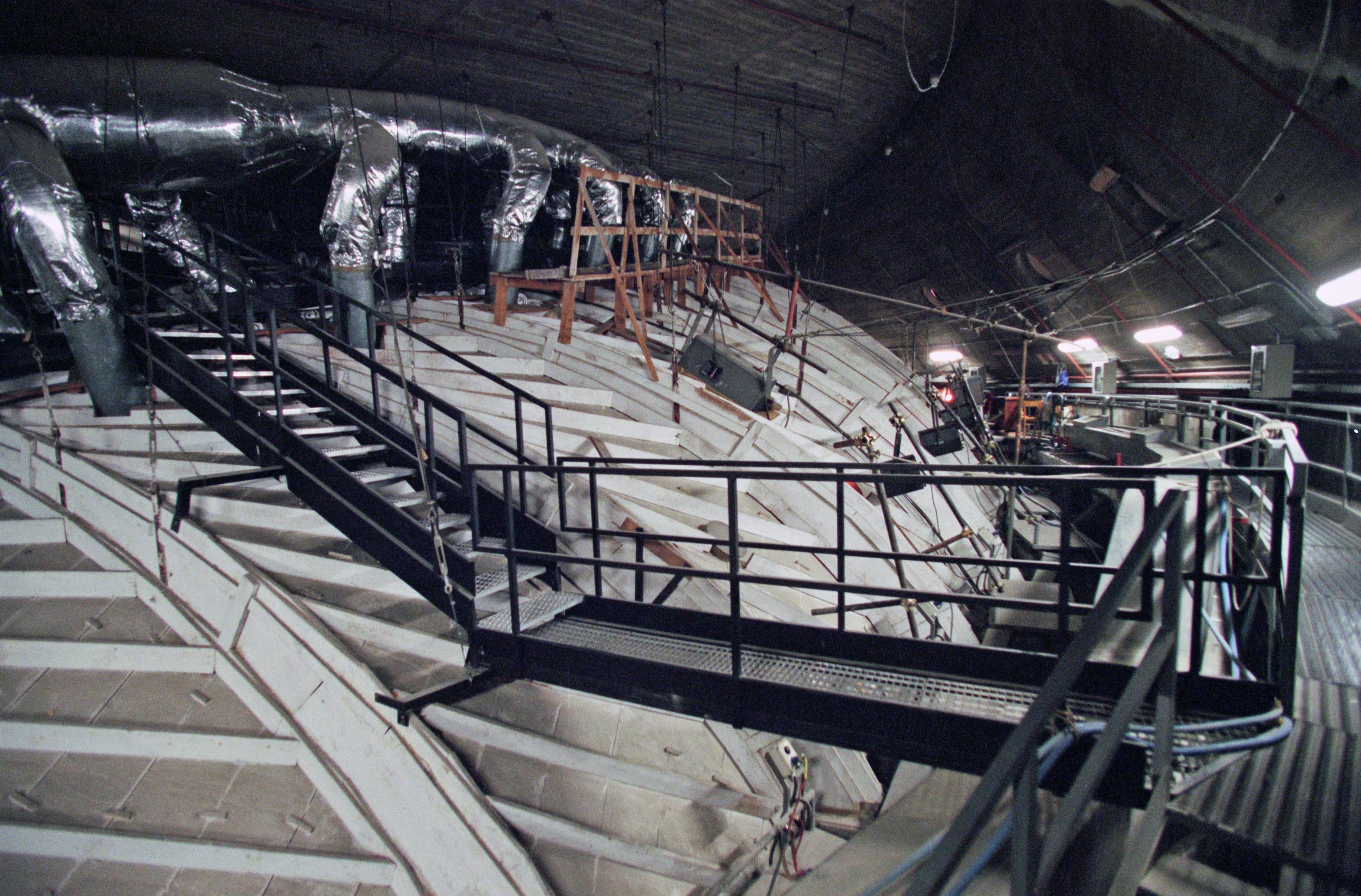 The air space between the wooden ceiling and the concrete hyperbolic paraboloid