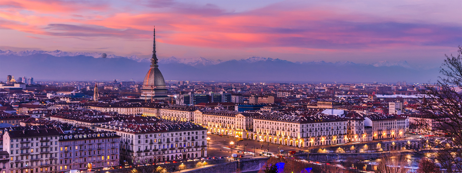 Turin at sunset View of Turin at sunset beneath a pink sky
